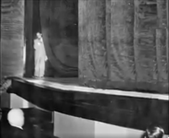 Mordechai Zlotnik peeking from Habima stage left